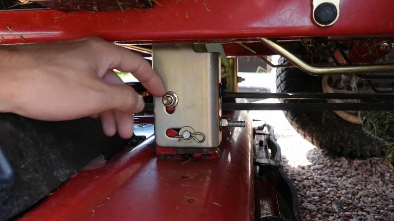 Adjust the mower deck and overlap passes to achieve an even cut on slopes