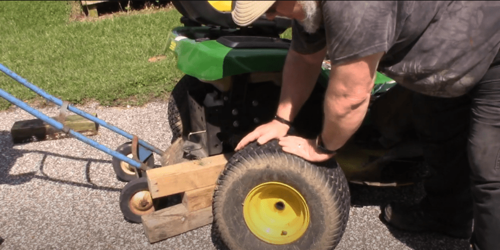 Keep the lawn mower in a stable, safe position
