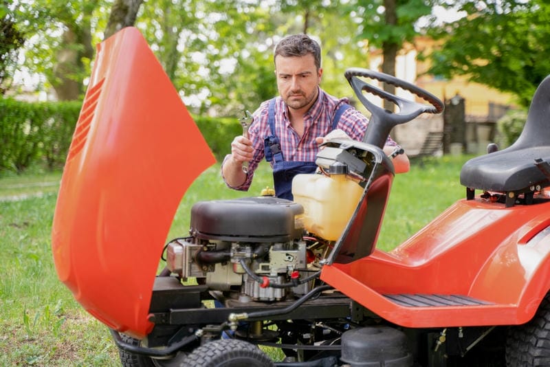 Look for signs like misfiring, power drops, or hard starting—these indicate your carburetor needs cleaning
