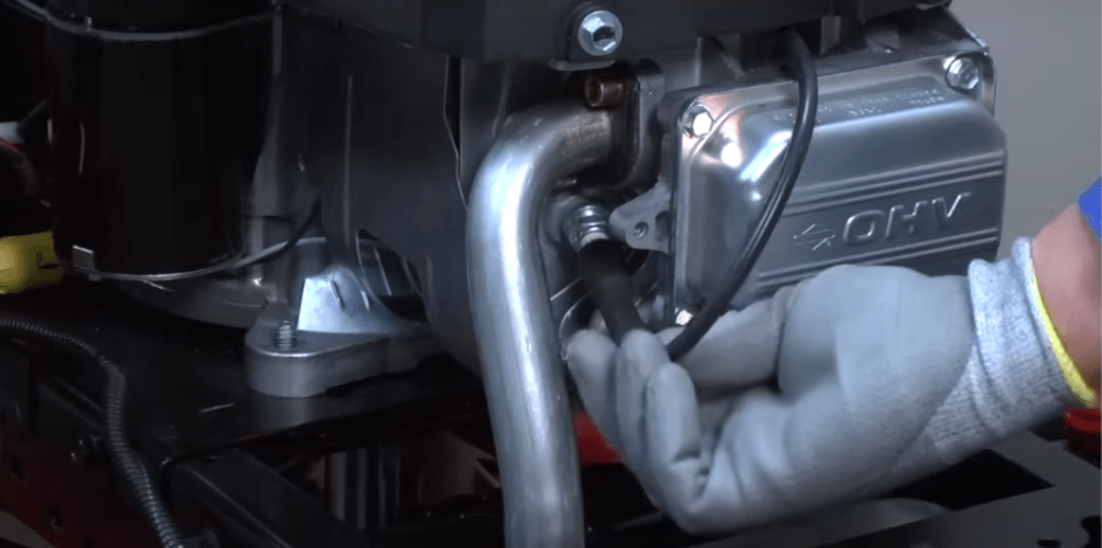 Remove the lawn mower spark plug