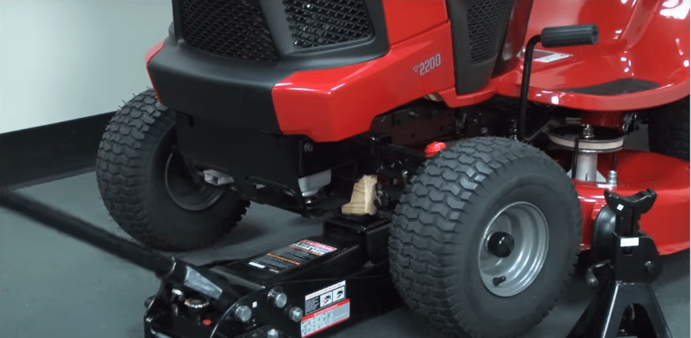 Safely jack up the mower on level ground for a secure and steady repair process