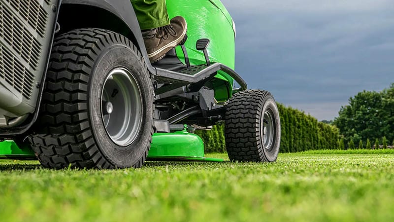 Upgrade your mower with traction tires and frame reinforcements using a wrench set and welder for enhanced hill performance and safety