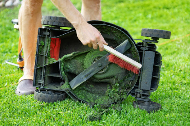 how to lift riding lawn mower to change blades